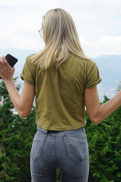 Veronica Leal posing all over her hood in green shirt and tight jeans Image #16