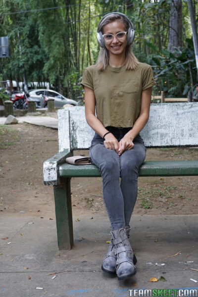 Veronica Leal posing all over her hood in green shirt and tight jeans Image #1