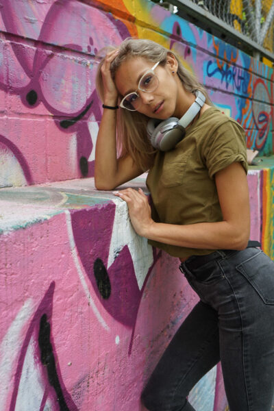 Veronica Leal posing all over her hood in green shirt and tight jeans Image #8