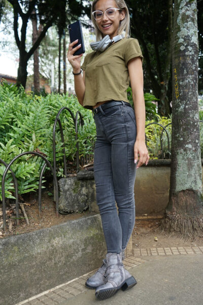 Veronica Leal posing all over her hood in green shirt and tight jeans Image #10