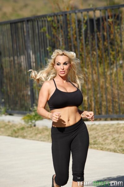 Busty blonde Holly Halston wets big tits while exercising clothed outdoors Image #18