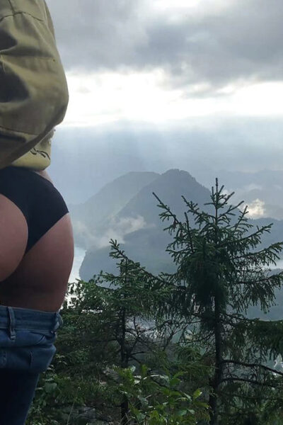 Blonde Russian Eva Elfie gives oral pleasure on the top of the mountain Image #4