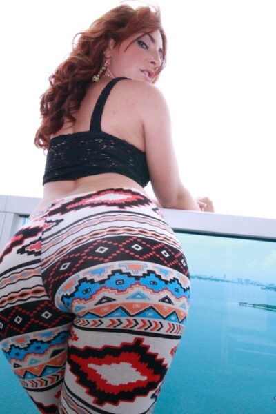 Redhead teen Savannah Fox showcases huge oiled bubble butt outdoors in thong Image #1