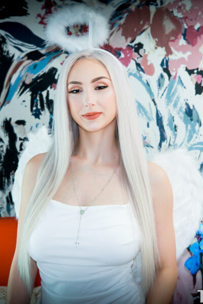 Angelic blonde with big tits Dylann Vox gets fucked on the couch by her hunk Image #1