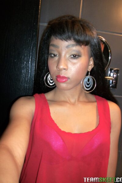 Afro-American hottie Mimi West flashes her delicious tits and ass in public Image #1