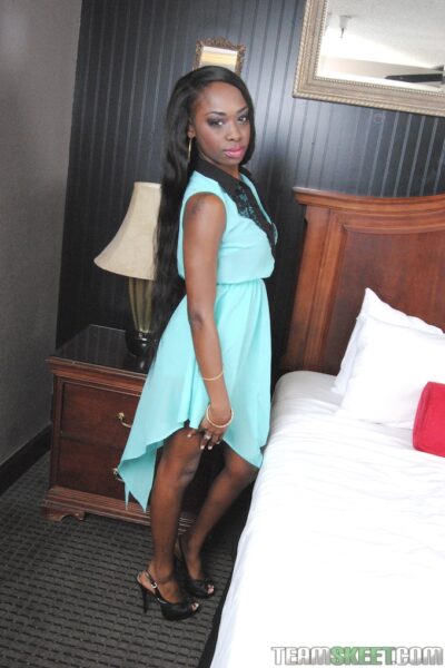 Ebony teen Ciara Rose getting naked and spreading her legs on the bed Image #1