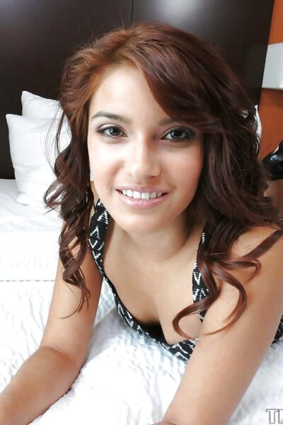 Loveable brunette with shaved cooter undressing and spreading her legs Image #4