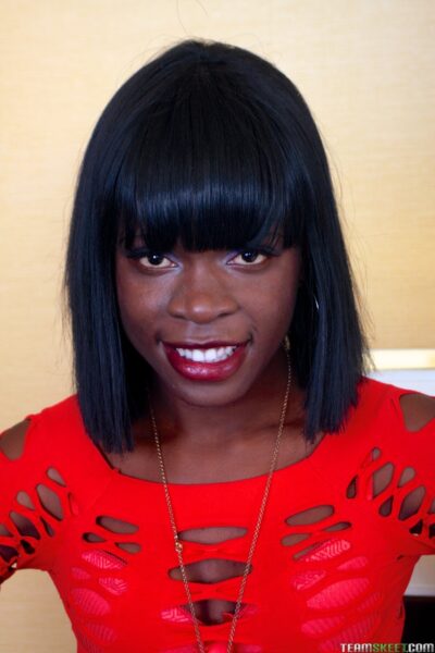 Skinny Jamaican ebony Sasha Fierce strips and masturbates with a sex toy Image #3