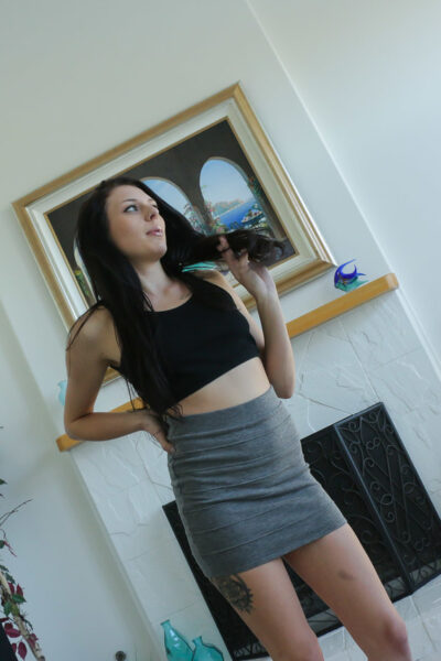 Appealing petite Megan Sage in min skirt & thong slowly sucks cock in POV Image #1