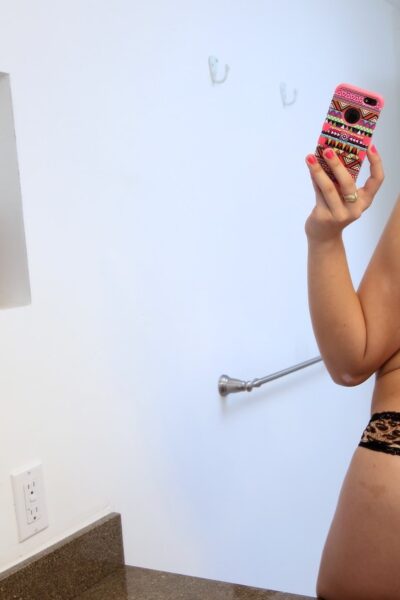 Curly haired beauty Carmen Caliente takes a selfie of her booty in the mirror Image #4