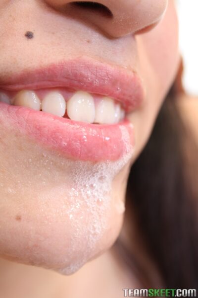 Naturally busty teen Sharon Hernandez catches a bubbly facial in MMF threesome Image #21