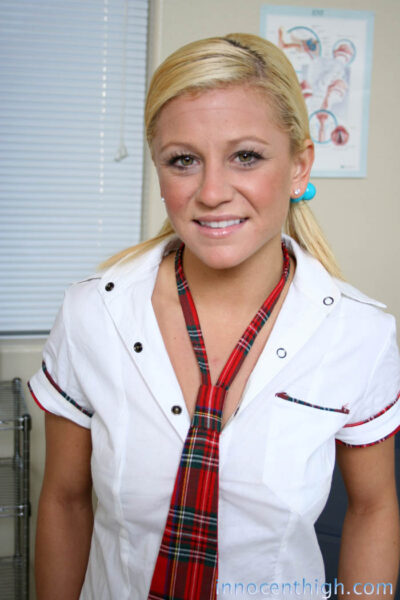 Pigtailed blonde schoolgirl Cali Cassidy flashes pussy & tight ass in uniform Image #1