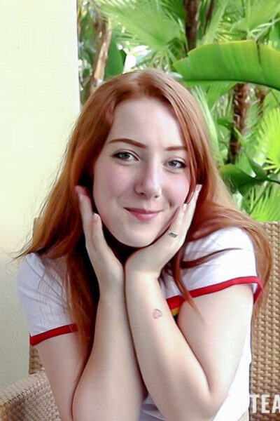 Young redhead Amber Addis gives a hung stud a hot blowjob while naked Image #1