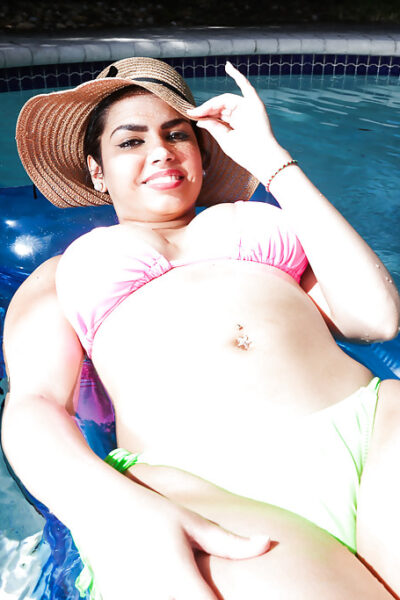 Brunette babe model Ada S going topless on air mattress in swimming pool Image #8