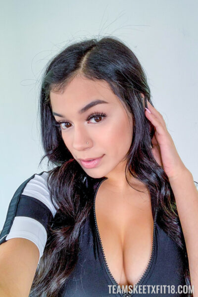 Raven-haired teen Savannah Sixx strips her sportwear & shows her big boobs Image #13