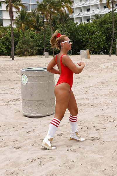 Sexy blonde beach bunny Kelsi Monroe working out on beach in swimsuit Image #14