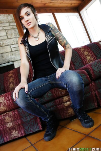 Slender tattooed babe in jeans gets naked and masturbates nicely Image #4
