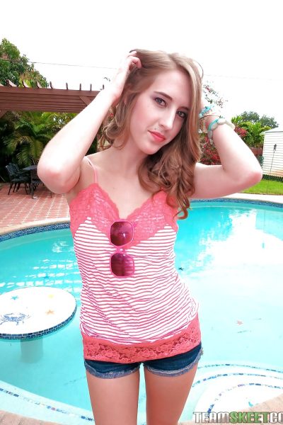 Cute babe Cadence Lux stripping and spreading her legs by the pool Image #4
