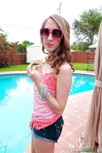 Cute babe Cadence Lux stripping and spreading her legs by the pool Image #1